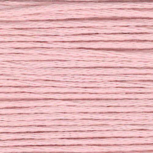 Close-up of warm pink embroidery floss-thread texture