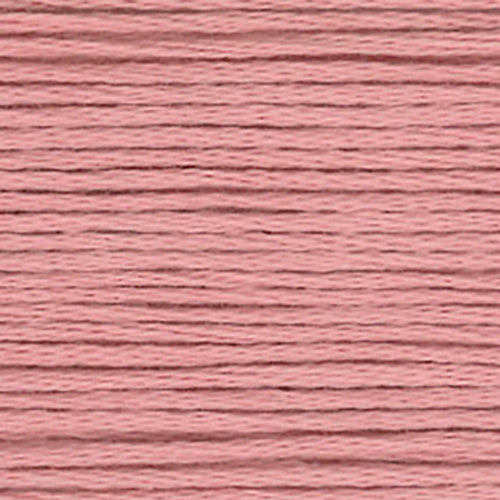 Close-up of pink embroidery floss with a textured pattern