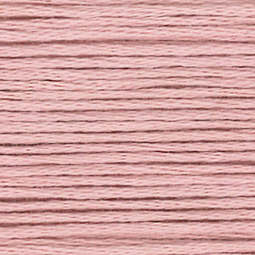 Close-up of pink embroidery floss with a textured pattern